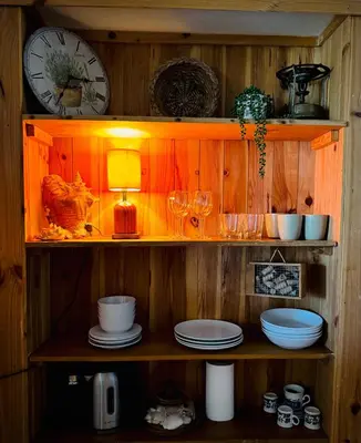 a bottle of laundry detergent next to a basket with teddy bears at Fisherman´s Cave in Faro