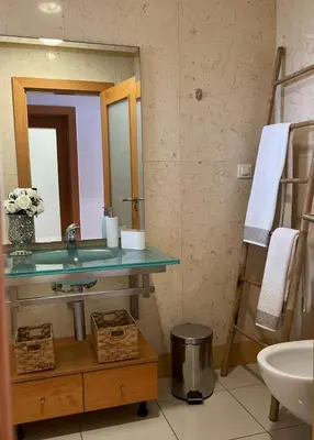 a bathroom with a sink and a mirror at Barracuda ByTheSea in Albufeira