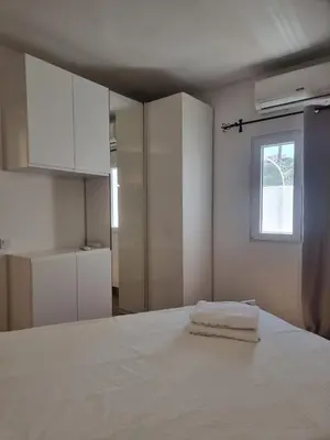 a bedroom with a white bed and a window at AAA T2 Awesome Albufeira Apartments Piscina Marina in Albufeira
