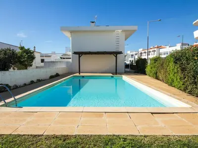 a swimming pool in the backyard of a house at Rainbow House by Stay ici Algarve Holiday Rental in Albufeira