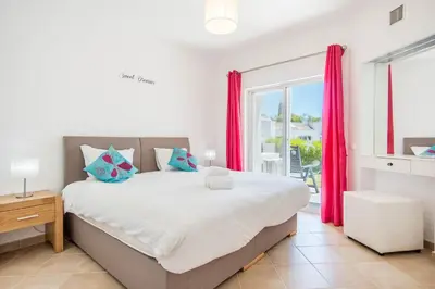 two beds sitting next to each other in a room at #025 T3 Encantador em Albufeira by Home Holidays in Albufeira