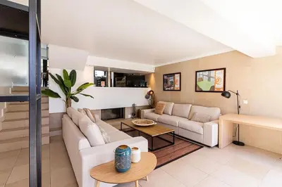 a living room with a couch and a table at BmyGuest - Vilamoura Marina's View in Vilamoura