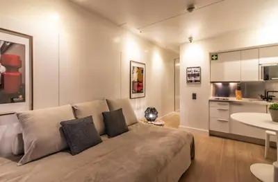 a living room with a couch and a kitchen at BmyGuest - Oura Beach Studio I in Albufeira