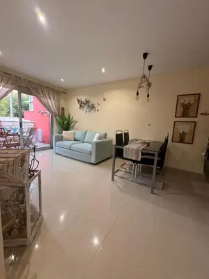 a living room with a couch and a table at Lendas de Portugal in Olhos de Água
