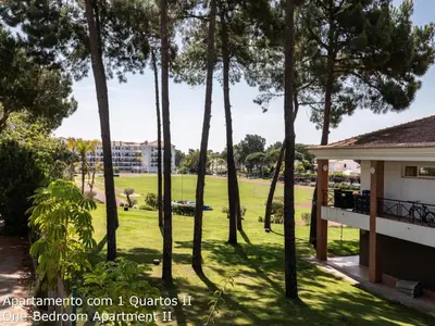 a view of a park from the balcony of a house at Akisol Albufeira Sunny in Roja- Pé