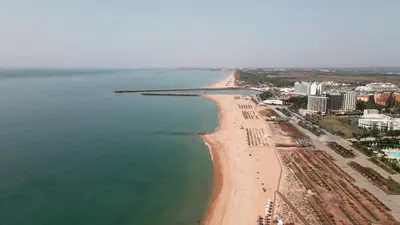 an aerial view of a beach with a pier at Beach Loft in Quarteira