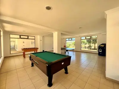 a living room with a pool table in it at Albufeira Terrace With Pool by Homing in Albufeira