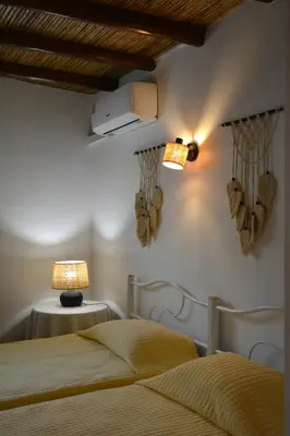 a green bench in a room with a window at SOLAR DOS AVÓS in Guia