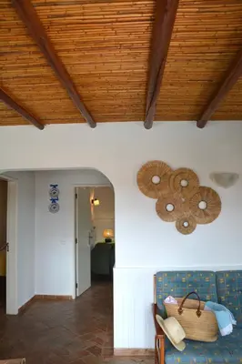 a bedroom with a large bed with a wooden ceiling at SOLAR DOS AVÓS in Guia