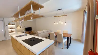 a kitchen and dining room with a table and a dining room at Forte Novo Beach in Quarteira