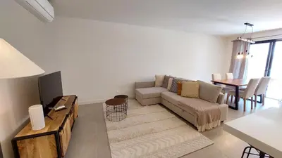 a living room with a couch and a table at Forte Novo Beach in Quarteira