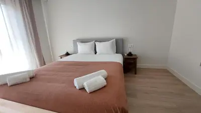 a bedroom with a large bed with two white pillows at Forte Novo Beach in Quarteira