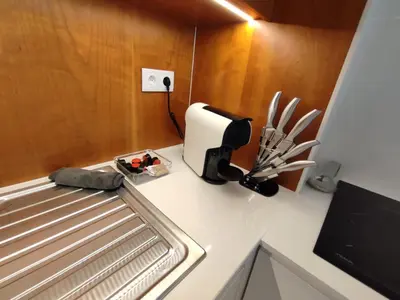 a kitchen with a counter with a knife holder on it at Sonho Azul in Albufeira