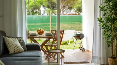 a living room with a couch and a table at Açoteias B3 in Albufeira