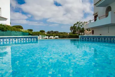 a swimming pool in front of a building at Açoteias B3 in Albufeira