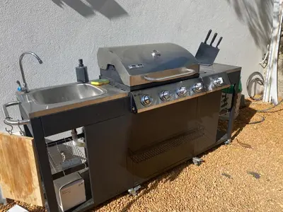 a kitchen with a sink and a stove at Vila Lobo Algarve in Faro