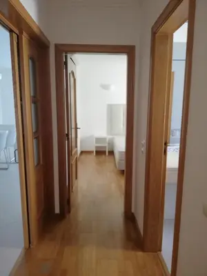 a hallway with two doors leading to a bedroom at Villa V2 U in Olhos de Água