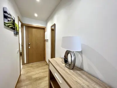a lamp sitting on top of a dresser in a room at Miral 4 - 100 mtr to beach by HD PROPERTIES in Quarteira
