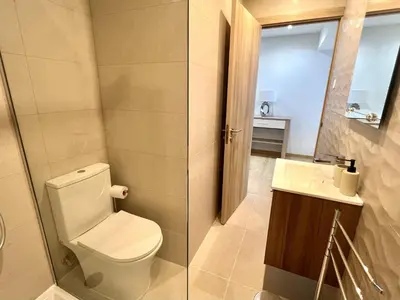 a bathroom with a toilet and a sink at Miral 4 - 100 mtr to beach by HD PROPERTIES in Quarteira