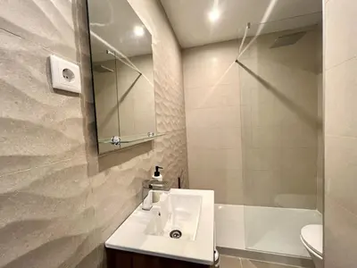 a white bathroom with a sink and a shower at Miral 4 - 100 mtr to beach by HD PROPERTIES in Quarteira