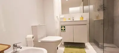 a bathroom with a toilet and a sink and a shower at 209 Modern Apartment in central Albufeira close to everything in Albufeira
