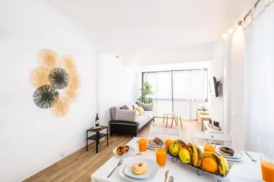 a living room with a couch and a table at #011 T1 Libertos by Home Holidays in Albufeira