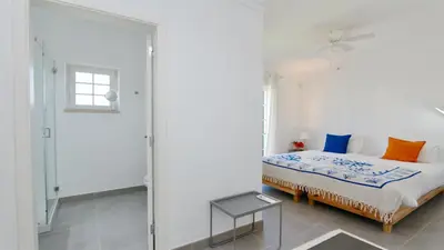 a white bedroom with a bed and a window at Vila Castro-Cleverdetails, Quiet area, private pool in Vilamoura