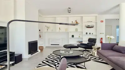 a living room with a couch and a table at Vila Castro-Cleverdetails, Quiet area, private pool in Vilamoura