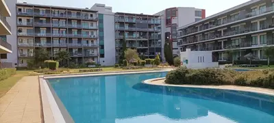 a swimming pool in front of some apartment buildings at RESIDENCE GOLF CLUB 415 in Quarteira