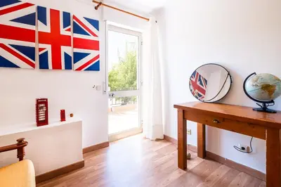two beds in a small room with a room with at #047 Families Only - Almond Tree by Home Holidays in Albufeira