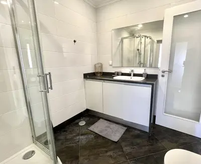 a bathroom with a sink and a shower at Topazio - Pool & near the center by HD PROPERTIES in Vilamoura