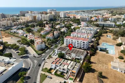 an aerial view of a city with buildings and a road at NUZZA - Vilamoura Marina with BBQ in Vilamoura
