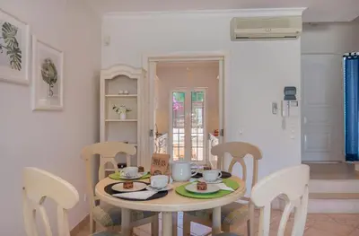 a table and chairs in a room with a table and chairsktop at Oceans 8. in Almancil