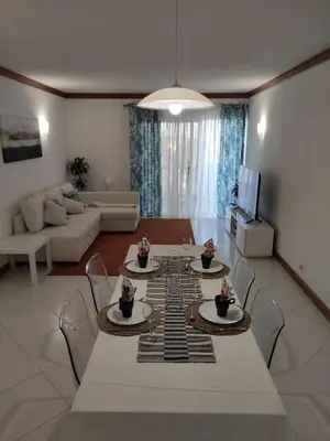 a living room with a white table and chairs at Vilamoura Marina, Av Tivoli in Vilamoura