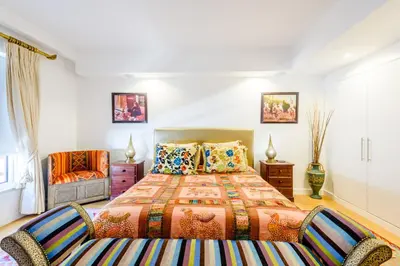 a bedroom with a bed and a couch at Marina Real - Sea View by HD PROPERTIES in Vilamoura