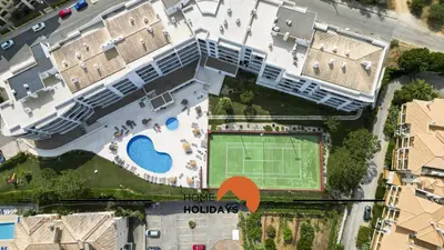 an aerial view of a building with a tennis court at #093 Vista das Ondas by Home Holidays in Albufeira