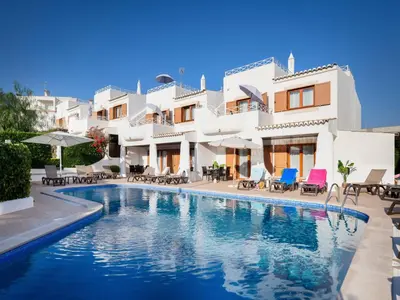 a swimming pool in front of a villa at Akisol Olhos de Água Ocean in Albufeira