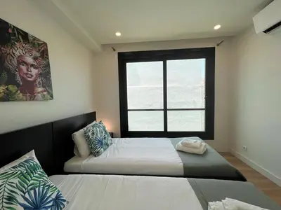 a bedroom with a bed and a window at Faro Design 1 by Homing in Faro