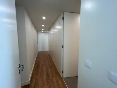a hallway with white walls and a door at Faro Design 4 by Homing in Faro