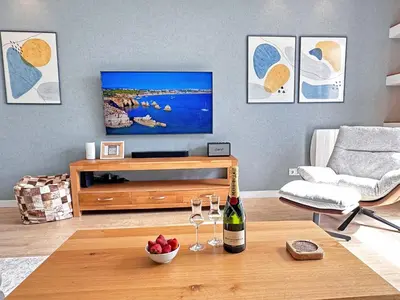 a kitchen with a counter top with a microwave at Luxury Albufeira Townhouse with Terraces, Pool & Views by Be Cherish in Albufeira