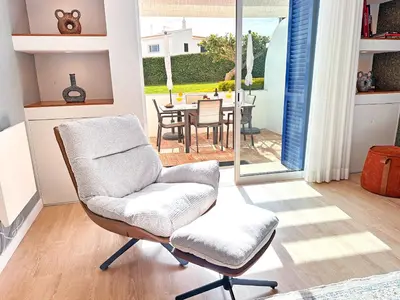 a living room with a couch and a tv at Luxury Albufeira Townhouse with Terraces, Pool & Views by Be Cherish in Albufeira