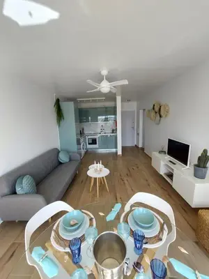 a living room with a couch and a table at Sun&Sea in Quarteira