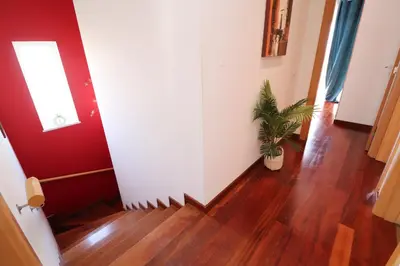 a hallway with a potted plant on the floor at 3-Bed Townhouse with pool in Albufeira Balaia in Albufeira