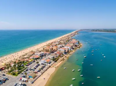 an aerial view of a beach with boats in the water at Faro Design 7 by Homing in Faro