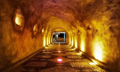 a tunnel with lights in the end of a tunnel at In Downtown - Villa Serenity in Albufeira