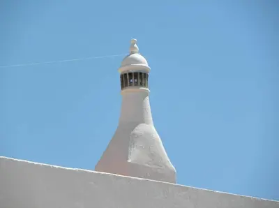 a lighthouse sitting on top of a roof at In Downtown - Villa Serenity in Albufeira