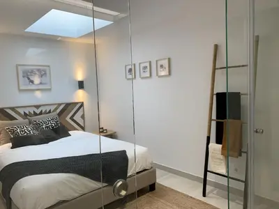 a bedroom with a bed with a glass wall at Albufeira Deluxe Residence With Pool by Homing in Albufeira