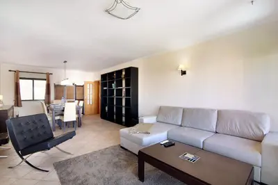 a living room with a couch and a table at Casa dos Salgados in Albufeira