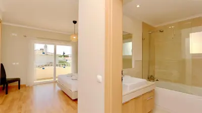 a bathroom with a tub and a sink and a shower at Villa Bolivia-CleverDetails in Vilamoura
