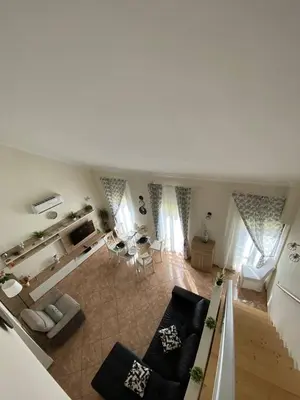 a large living room with a couch and a table at Guesthouse Milagre Centro Faro in Faro